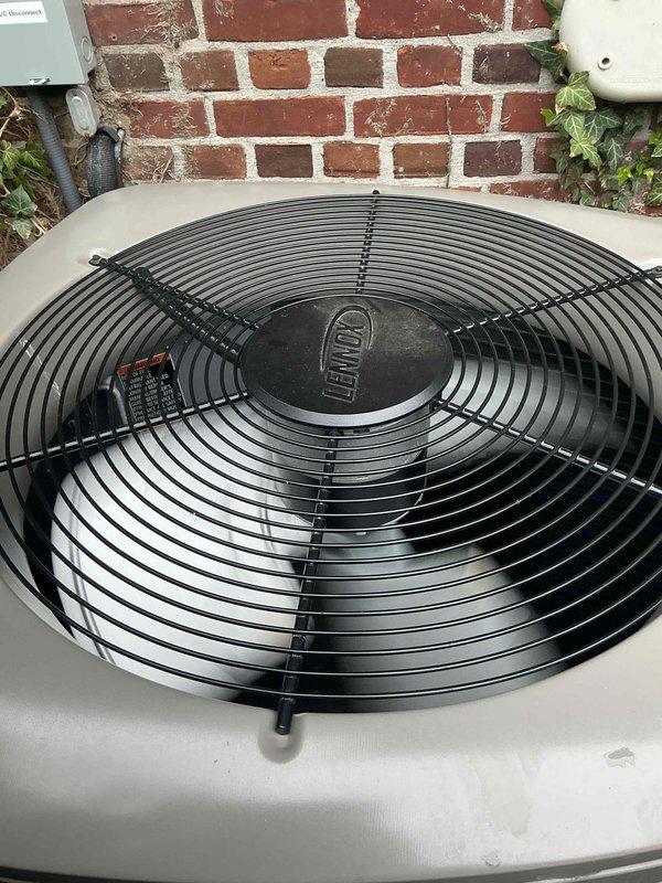 Completed comprehensive Gold AC inspection on multi-unit residential HVAC system consisting of three units with two air handlers located in attic and one coil assembly in basement. Performed diagnostic testing on 9-year-old Lennox equipment using Fieldpiece instrumentation, recording system pressures, return air dry bulb at 65.7°F, return air wet bulb at 57.5°F, supply air dry bulb at 42.2°F, and supply air wet bulb at 40.9°F with R454B refrigerant. Verified outdoor condenser unit operational status, inspected fan assembly and housing, confirmed proper airflow and clearance around equipment, and documented all system parameters within acceptable operating ranges.