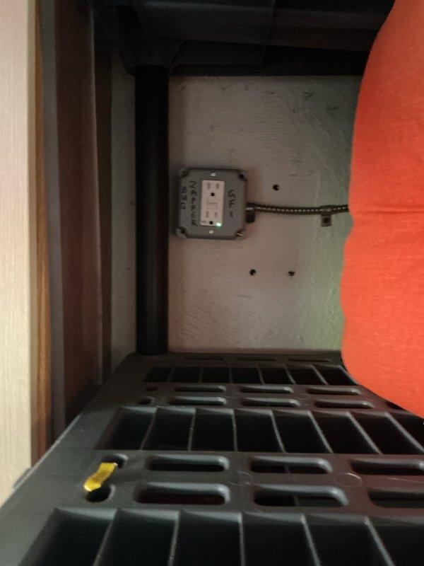 Responded to callback regarding non-functional fixtures from previous installation. Upon arrival, inspected electrical devices and connections in storage area where white sensor or outlet adapter with green indicator light was mounted on gray surface. Verified proper installation and functionality of electrical components. Device appeared to be operating correctly as indicated by illuminated green status light. Checked wiring connections and cable routing to ensure secure installation. All electrical fixtures tested and confirmed working properly. Issue resolved, no defects found in original installation work.