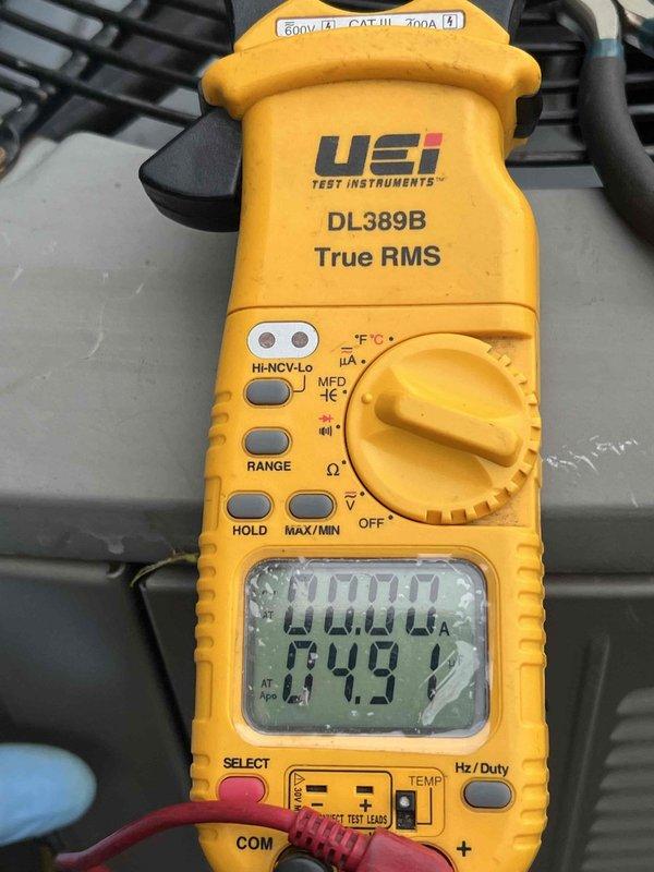 Completed comprehensive Gold AC inspection on 10+ year old single unit system with air handler located in basement. Performed electrical diagnostics using digital multimeter, measuring amperage draw at 0.000A and voltage reading of 242V, along with capacitance testing showing 846.3 MFD to verify proper compressor and fan motor operation. System found operating within normal parameters with all components functioning correctly at time of inspection.