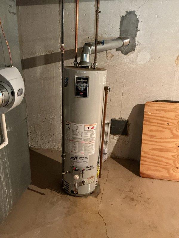 Responded to no hot water complaint affecting entire residence. Upon arrival, accessed basement utility area through rear entrance as requested. Inspected tank-style water heater and associated copper supply lines. Diagnosed failed heating element preventing proper water temperature. Replaced defective heating element, tested thermostat functionality, and verified proper electrical connections. Restored hot water service to all fixtures throughout the home. Unit tested and confirmed operational before departure.