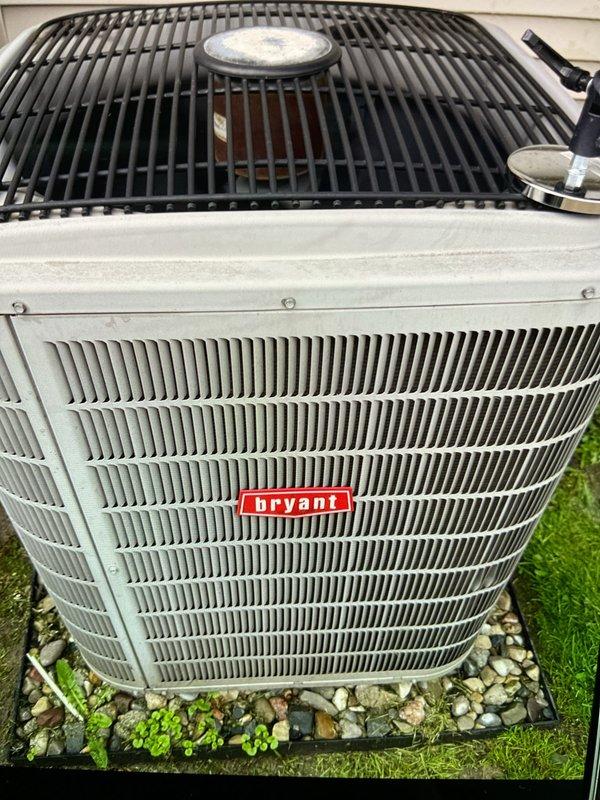 Completed comprehensive Gold AC inspection on 16-year-old Bryant air conditioning system with air handler located in basement. Performed thorough evaluation of outdoor condensing unit, conducted electrical diagnostics using digital multimeter to verify proper voltage and amperage readings across system components, and confirmed all equipment operating within normal parameters. System found to be functioning properly with no immediate service needs identified.