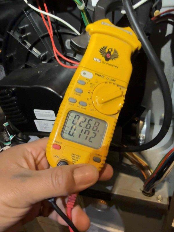Completed comprehensive Gold AC inspection on 16-year-old Bryant air conditioning system with air handler located in basement. Performed thorough evaluation of outdoor condensing unit, conducted electrical diagnostics using digital multimeter to verify proper voltage and amperage readings across system components, and confirmed all equipment operating within normal parameters. System found to be functioning properly with no immediate service needs identified.