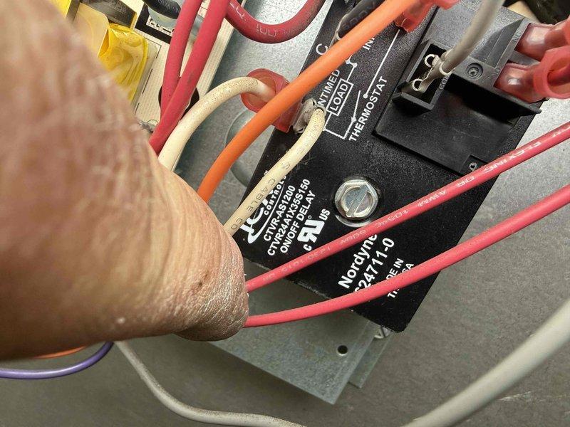 Responded to callback for heating fault on 8-year-old ceiling-mounted furnace unit. Accessed equipment in attic space using ladder and inspected electrical components including relay and control board connections. Diagnosed and addressed heating system malfunction, verified proper operation of air handler with blue LED status indicators, and confirmed all electrical connections and ductwork were secure and functioning correctly.