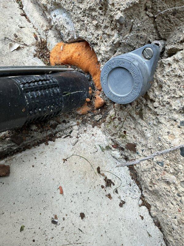 Responded to service call for hydronic heating system with one radiator not heating properly. Upon inspection, found that supply piping to radiator was getting hot but heat was not transferring to radiator body, indicating potential air lock or valve obstruction. Examined radiator valve assembly and shaft mechanism, noting significant corrosion and wear on internal components. Diagnosed issue as failed or stuck radiator valve preventing proper water circulation through the unit. Recommended valve replacement or rebuild to restore proper heating function to affected radiator.