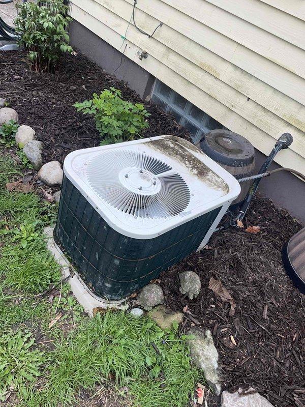 Provided comprehensive HVAC replacement estimate for 30-year-old air conditioning system including outdoor condensing unit and evaporator coil located in basement mechanical room. Assessed existing Bryant furnace/air handler compatibility and evaluated current installation conditions including electrical service, refrigerant line sets, condensate drainage, and outdoor unit placement in landscaped area. Documented equipment specifications and recommended replacement options for complete cooling system upgrade to improve efficiency and reliability.