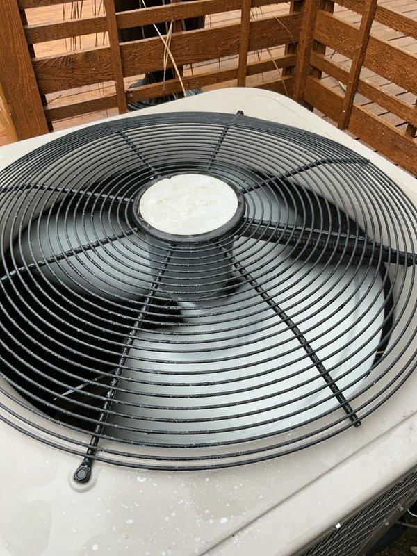 Completed comprehensive Gold AC Inspection on 7-year-old air conditioning system with outdoor condenser unit located on deck and air handler/coil in basement. Performed full system evaluation including visual inspection of condenser unit showing good overall condition with minor dust accumulation on fan grille and protective components, verified proper electrical connections at exterior junction box with conduit routing, and confirmed system operational status. Unit demonstrated satisfactory performance with all components functioning as designed under favorable weather conditions suitable for accurate testing and assessment.