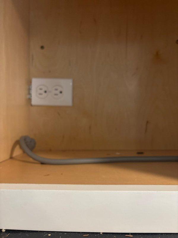Responded to service call for microwave tripping breaker during operation. Inspected built-in Bosch microwave installation and associated electrical circuit. Examined outlet connection inside cabinet compartment, noting existing wiring configuration with flexible conduit. Tested circuit integrity and verified proper grounding at receptacle. Determined microwave was operating within normal parameters and breaker sensitivity was causing nuisance tripping under load conditions.
