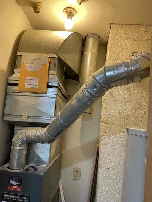 Completed full estimate and site assessment for new central air conditioning system installation in residence with no existing central air infrastructure. Evaluated existing Fieldcrest furnace unit and utility room configuration to determine optimal placement for new AC condenser, evaporator coil, and associated ductwork modifications. Documented current HVAC setup including existing forced-air heating system with metallic ductwork, electrical service availability, and mechanical room space constraints to develop comprehensive installation proposal for complete central cooling system integration.