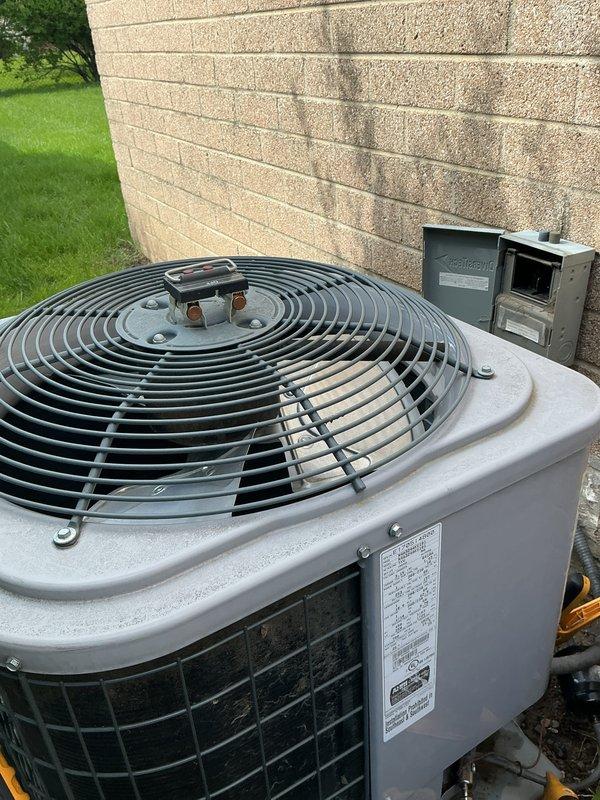 Completed NSP AC inspection on residential property with 10+ year old outdoor condenser unit and 4-year-old furnace located in basement. Performed comprehensive system evaluation including visual inspection of indoor furnace components, control board, electrical connections, and blower assembly. Inspected outdoor condenser unit, verified fan operation, checked refrigerant lines, and assessed overall equipment condition. All components found operating within normal parameters. System deemed functional with no immediate repairs required at time of inspection.