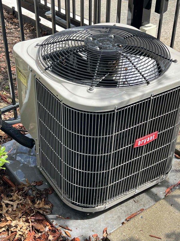 Completed comprehensive tune-up and performance evaluation on 10-year-old Bryant air conditioning system. Performed visual inspection of outdoor condenser unit, verified proper electrical readings using digital multimeter showing normal voltage levels, and confirmed system operational status. Documented equipment condition with photographic records for maintenance history.