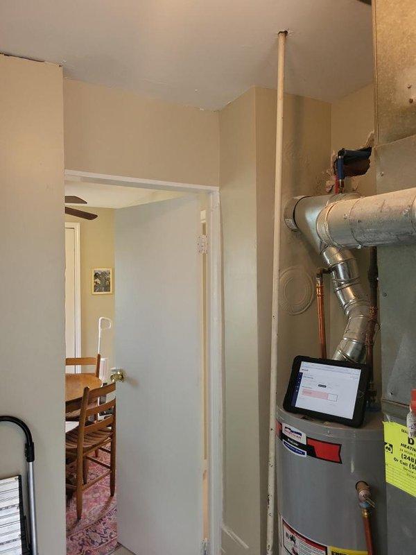 Conducted on-site assessment for central air conditioning system installation at residential property. Evaluated existing utility room infrastructure, including current ductwork configuration, electrical service capacity at meter location, and available space for new equipment placement adjacent to water heater. Documented exterior wall access points and verified electrical service compatibility for new HVAC system requirements. Prepared comprehensive equipment replacement quote based on site conditions and customer cooling needs.