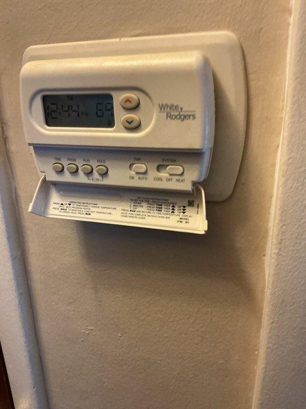 Responded to service call for 8-year-old furnace located in basement with reported blower failure and potential thermostat issues. Performed diagnostic assessment of heating system and examined White Rodgers digital thermostat for proper operation and wiring connections. Inspected blower motor assembly and related components to identify cause of failure and determine necessary repairs.