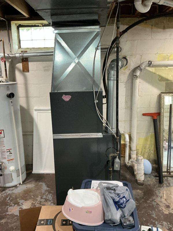 Completed full HVAC system replacement including removal of 18-year-old furnace with cracked heat exchanger and non-functional air conditioning equipment. Installed new high-efficiency furnace with properly configured ductwork connections and new condensing unit. Replaced existing 40-gallon water heater with new unit, ensuring proper venting and code-compliant installation. All systems tested and operational upon completion.