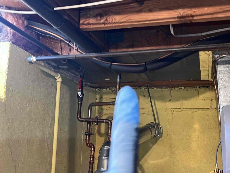 Completed comprehensive Gold AC inspection on an 11-year-old residential air conditioning system with air handler and coil located in basement. Performed full system evaluation including outdoor condenser unit inspection, verified proper clearances and unit condition, examined refrigerant lines and electrical connections, and inspected indoor air handler components, ductwork, and associated mechanical systems. All equipment confirmed operational with no immediate concerns identified during inspection.