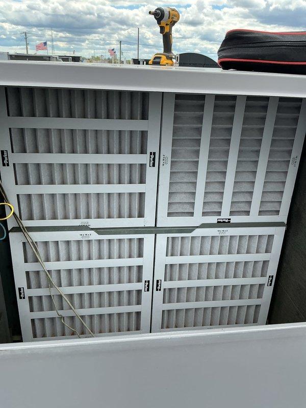 Performed filter change on one rooftop unit (RTU) at commercial facility. Accessed mechanical room via lockbox, utilized ladder to reach rooftop equipment, and replaced all four filters in the unit. All filters were successfully installed and unit returned to normal operation.