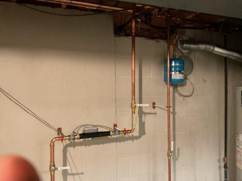 Replaced existing 50-gallon residential water heater that was failing to maintain proper water temperature. Installed new tanked water heater unit with copper supply line connections, pressure relief valve, and proper venting. Reconnected all plumbing fixtures, tested system operation to verify adequate hot water production and temperature output, and ensured all connections were secure and leak-free upon completion.