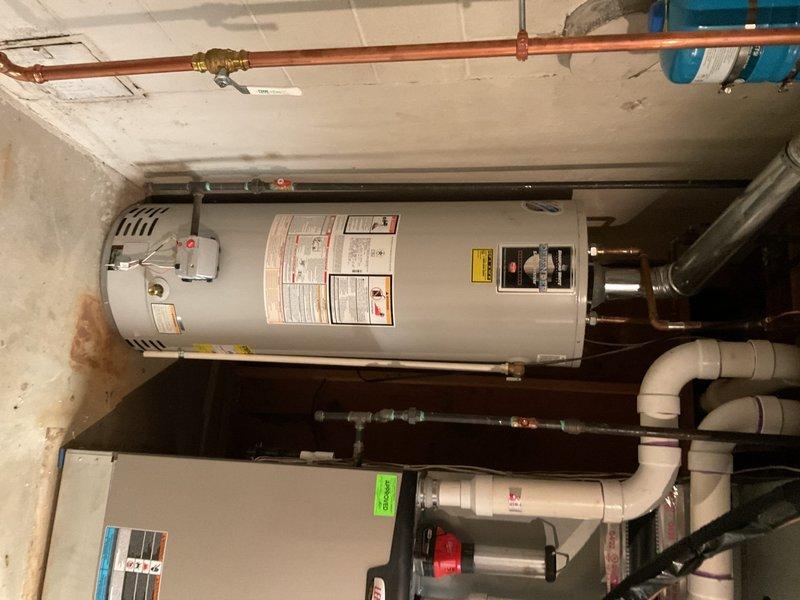 Replaced existing 50-gallon residential water heater that was failing to maintain proper water temperature. Installed new tanked water heater unit with copper supply line connections, pressure relief valve, and proper venting. Reconnected all plumbing fixtures, tested system operation to verify adequate hot water production and temperature output, and ensured all connections were secure and leak-free upon completion.