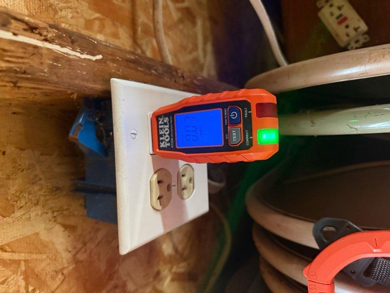 Responded to service call for no power in garage. Upon arrival, performed electrical diagnostics using digital multimeter to test outlet functionality and circuit integrity. Testing revealed power supply issues at garage receptacle mounted on wooden framing in utility space. Verified proper voltage readings and circuit continuity after troubleshooting. Utilized Klein Tools testing equipment to confirm restoration of electrical service to affected outlets. All receptacles tested and verified operational upon completion.