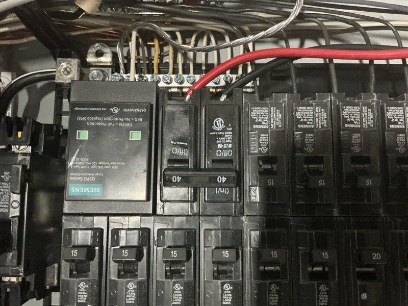 Responded to warranty call for newly installed system with possible contactor failure. Upon inspection, verified electrical connections at breaker panel and confirmed proper power supply to unit. Documented Siemens electrical components and circuit breaker configuration for service records.