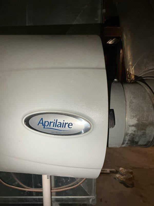Completed comprehensive Gold AC inspection on 4-year-old residential cooling system with air handler located in basement. Performed full system evaluation including outdoor condensing unit assessment, verified proper operation of fan assembly and coil condition, inspected basement-mounted Aprilaire whole-house humidifier and associated ductwork connections. All components found operating within normal parameters with no immediate service needs identified at time of inspection.