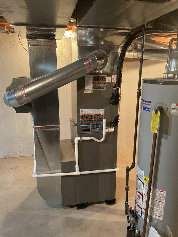 Completed installation of 2.5 ton air conditioning unit with matching evaporator coil in rear discharge configuration. Connected new AC system to existing furnace, verified all refrigerant lines, electrical connections, and condensate drainage were properly installed per manufacturer specifications and local mechanical permit requirements.