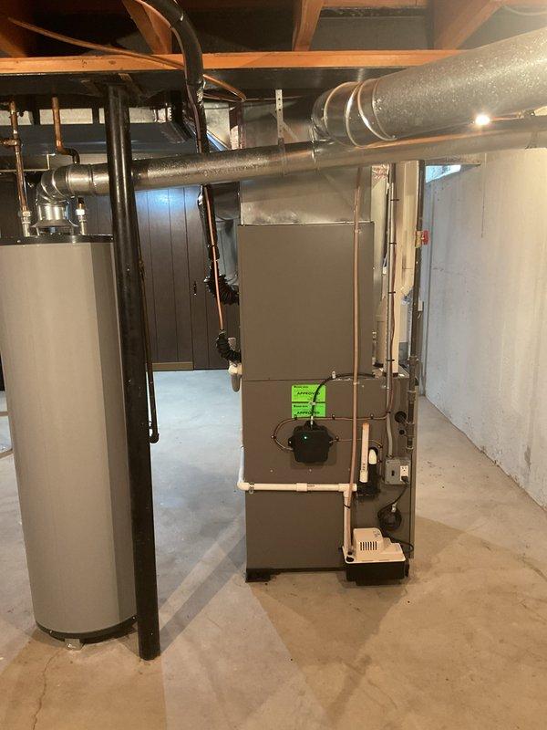 Completed installation of 2.5 ton air conditioning unit with matching evaporator coil in rear discharge configuration. Connected new AC system to existing furnace, verified all refrigerant lines, electrical connections, and condensate drainage were properly installed per manufacturer specifications and local mechanical permit requirements.