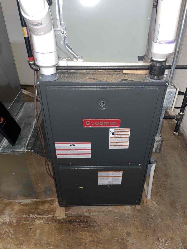 Provided estimate for air conditioning system replacement to address non-functional cooling system from previous summer. Evaluated existing Goodman furnace installation, which was recently replaced and will be retained in the system configuration. Assessed current thermostat setup (PRO1 digital unit) and existing ductwork connections to ensure compatibility with proposed air conditioning equipment replacement while maintaining the operational heating system.