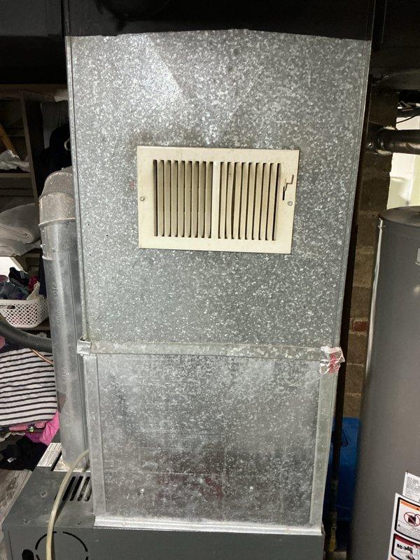 Conducted comprehensive site assessment for complete HVAC system replacement in residential basement installation. Evaluated existing air handler unit with galvanized metal exterior and associated ductwork configuration for replacement and relocation to alternative position within the space. Assessed current furnace system and provided technical specifications for complete heating system replacement, documenting existing equipment conditions, ductwork routing, and spatial requirements for proposed system modifications.