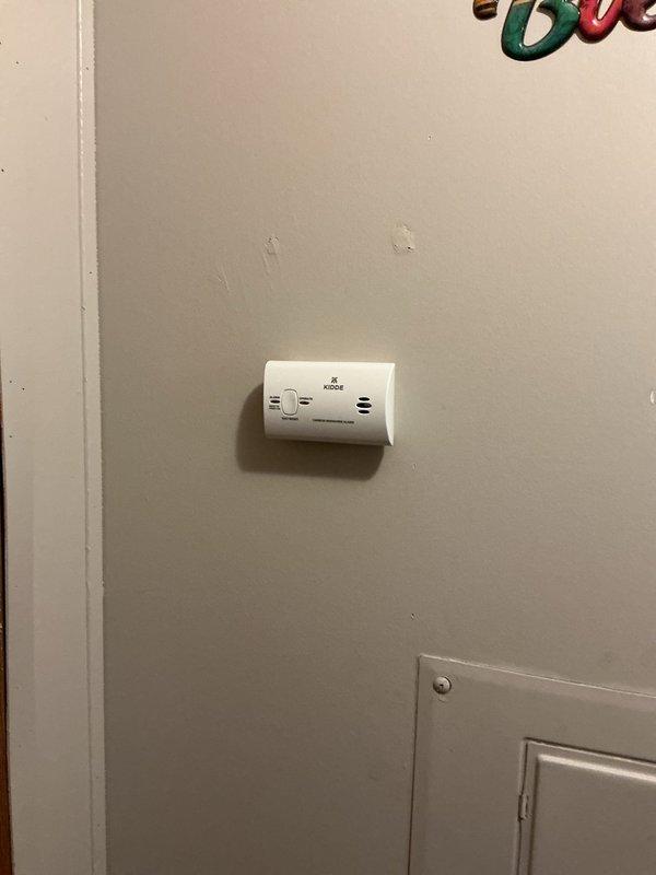 Responded to service call regarding unusual odor from furnace. Upon arrival, installed Kidde carbon monoxide detector on interior wall as a safety precaution. Unit was mounted securely in accessible location for ongoing monitoring of potential CO emissions from heating system.