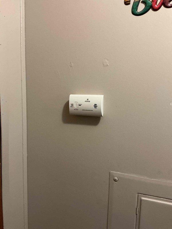 Responded to service call regarding unusual odor from furnace. Upon arrival, installed Kidde carbon monoxide detector on interior wall as a safety precaution. Unit was mounted securely in accessible location for ongoing monitoring of potential CO emissions from heating system.