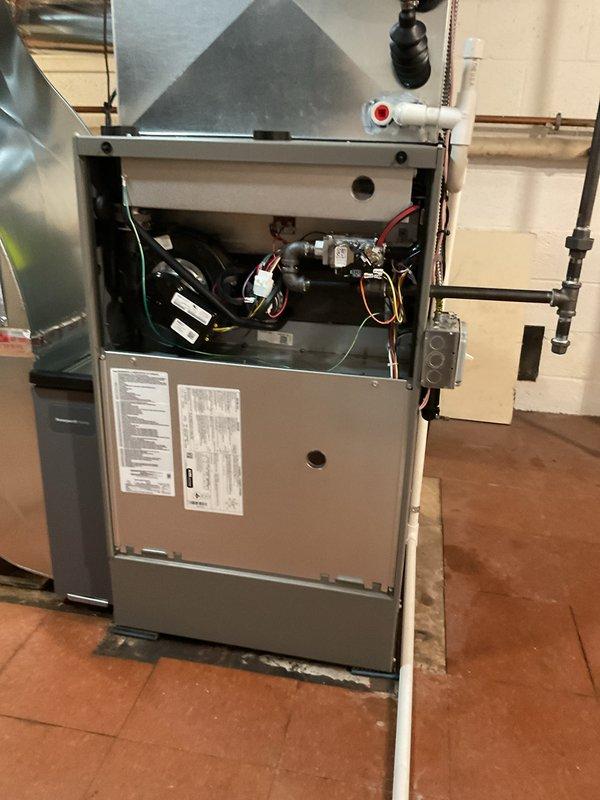 Completed full HVAC system installation including 135,000 BTU gas furnace and 5-ton rear-discharge air conditioning unit with complete ductwork integration. Installed humidifier, performed refrigerant line flush, and reconnected all gas and electrical components per manufacturer specifications. Mechanical permit obtained and system tested for proper operation with all safety controls verified functional.