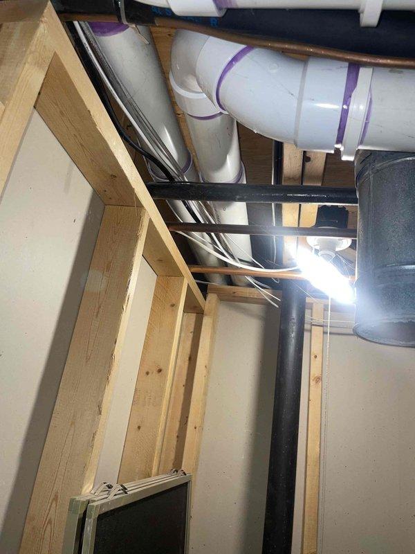 Completed comprehensive HVAC system inspection and provided estimate for air conditioning unit and combined AC/furnace replacement system in basement location. Inspection included thorough evaluation of existing 2016 equipment, humidifier operation, thermostat functionality, and hot water tank condition. Documented electrical panel configuration, exposed mechanical infrastructure, plumbing connections, and ductwork layout to prepare accurate replacement specifications for requested 5-ton, 2-stage system upgrade.