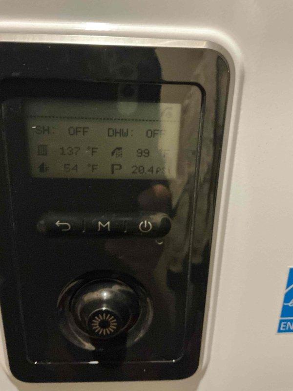 Responded to no heat call on 3-year-old boiler system located in basement. Upon arrival, found boiler not producing heat and completely silent during call for heat. Performed diagnostic evaluation and identified failed 3-way valve preventing proper operation of both central heating (CH) and domestic hot water (DHW) circuits. Control panel displayed CH: OFF and DHW: OFF status with temperature readings of 137°F and 94°F respectively. Inspected internal wiring harness and electrical connections to valve assembly. Documented existing conditions including valve positioning, wire routing, and control system status. Confirmed 3-way valve requires replacement to restore heating function. Advised that replacement part is available and system will be fully operational once new valve is installed and commissioned.