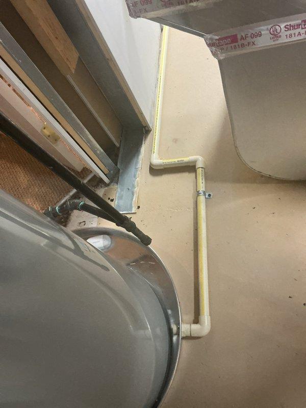 Responded to code violation MRC2015-2801.6/.2 regarding improper condensate pan discharge. Inspected HVAC system and air handler unit in mechanical space, identifying condensate drain line requiring proper termination. Rerouted and terminated pan discharge line to nearby floor drain in accordance with current plumbing code requirements, ensuring proper drainage and compliance with municipal regulations.