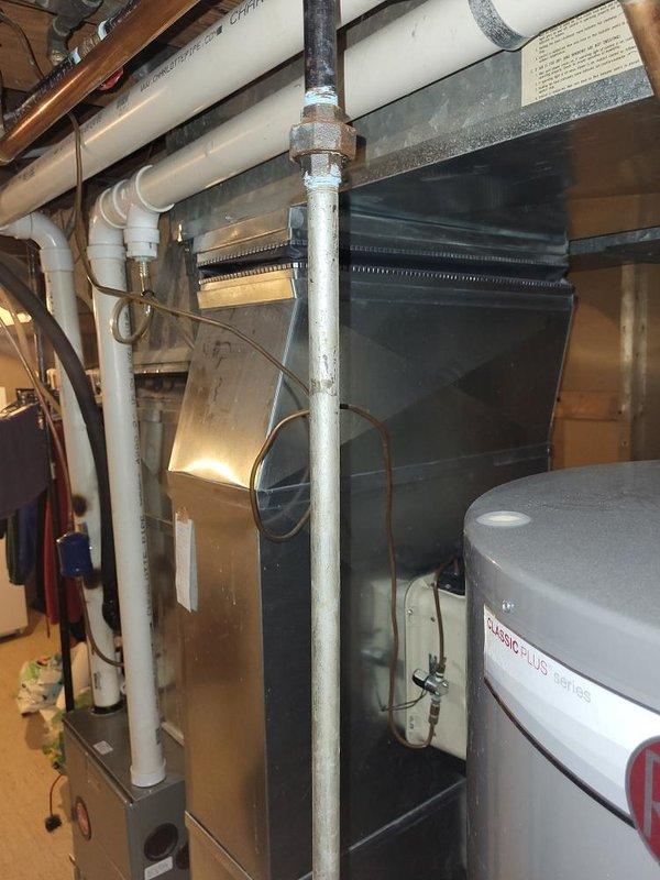 Completed comprehensive HVAC system evaluation on 16-year-old air conditioning system experiencing progressive refrigerant loss over two consecutive years and failing contactor. Performed Gold AC inspection on single-unit residential system with basement-located air handler, documenting exterior condenser unit mounted near brick wall structure and interior mechanical equipment configuration. Provided replacement estimate recommendations based on age of equipment, recurring refrigerant deficiency, and electrical component failure.