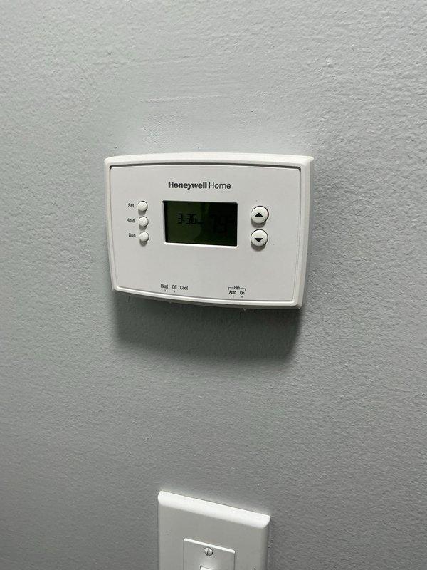 Completed preventive maintenance tune-up on residential HVAC system with coil air handler located in main level closet. Performed comprehensive inspection of furnace unit, verified thermostat operation and programming, checked all system components for proper function, and documented equipment condition through photographic records. All equipment found operating within normal parameters with no immediate service needs identified.