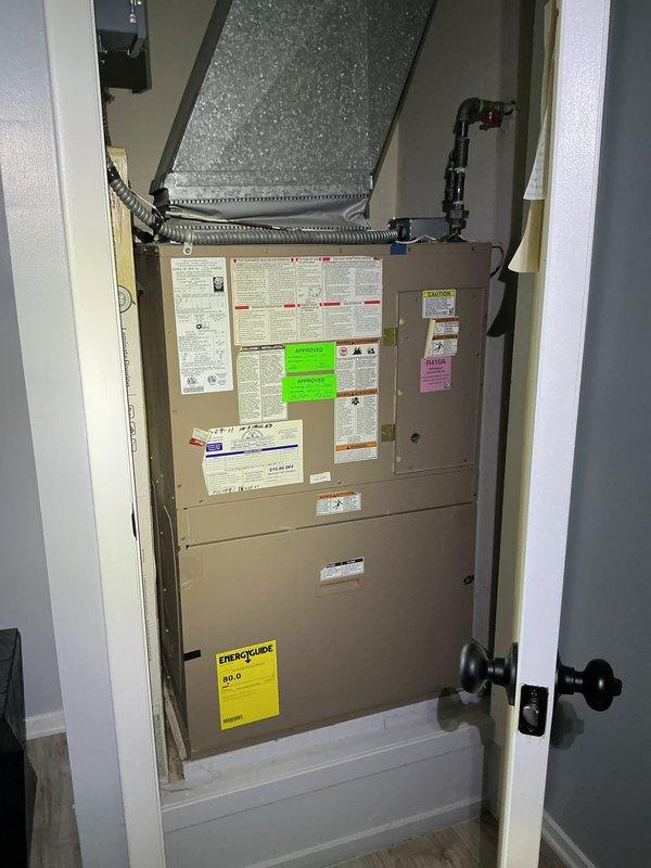 Completed preventive maintenance tune-up on residential HVAC system with coil air handler located in main level closet. Performed comprehensive inspection of furnace unit, verified thermostat operation and programming, checked all system components for proper function, and documented equipment condition through photographic records. All equipment found operating within normal parameters with no immediate service needs identified.