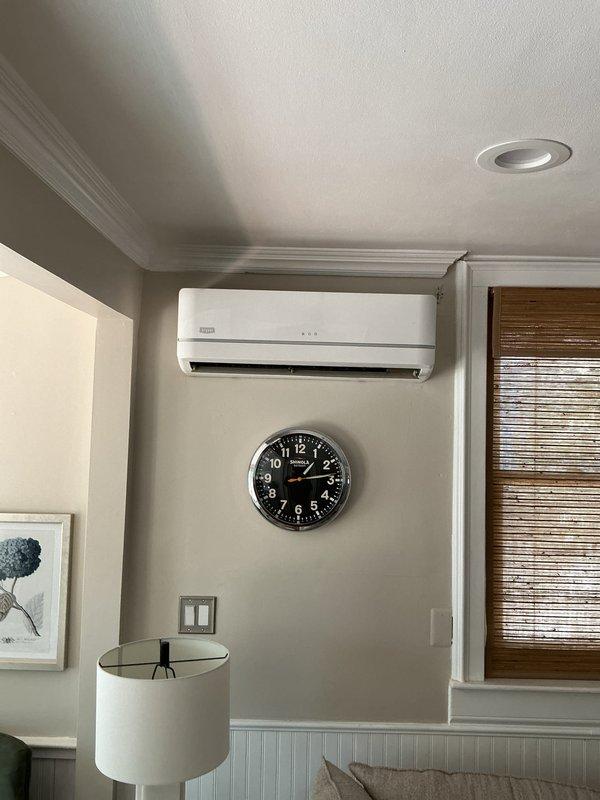 Completed estimate for replacement of 10+ year old ductless mini-split system. Assessed existing wall-mounted indoor air handler unit installed in living space and outdoor condenser unit positioned on concrete pad with gravel base. Provided replacement options and recommendations based on current system age and configuration.