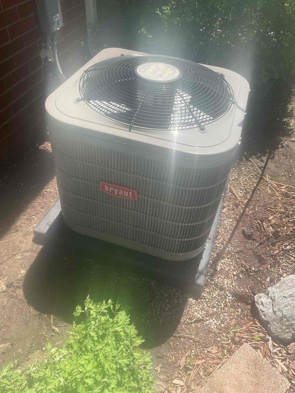 Completed AC tune-up on 6-year-old Bryant condenser unit with basement coil system. Performed visual inspection of outdoor condenser unit, removed access panel to inspect internal electrical components including capacitor and wiring connections, and verified all components were secure and functioning properly. Unit found in good operational condition with no immediate repairs needed.
