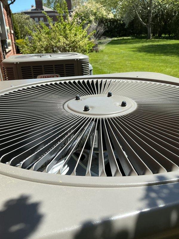 Completed comprehensive Gold AC inspection on 2-year-old residential HVAC system with air handler located in basement. Performed thorough evaluation of outdoor condenser units, verifying proper operation of fan motors, compressor function, and airflow through coil fins. Inspected condenser fan blades and grilles, confirming clean condition with no debris accumulation or obstructions. Evaluated electrical connections, refrigerant levels, and overall system performance under optimal weather conditions. Verified equipment is operating efficiently with no visible signs of wear, damage, or deterioration. Advised customer to maintain clear area around condenser units, keeping debris and animal waste away from equipment to ensure proper airflow and system longevity.