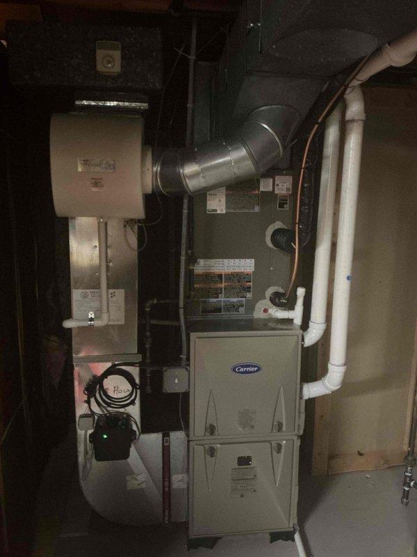 Completed installation of a 3-ton rear-discharge air conditioning system with matching evaporator coil, connecting to existing Carrier furnace in basement mechanical room. Mechanical permit was requested and all work performed to code specifications, with system reconnected and operational upon completion.