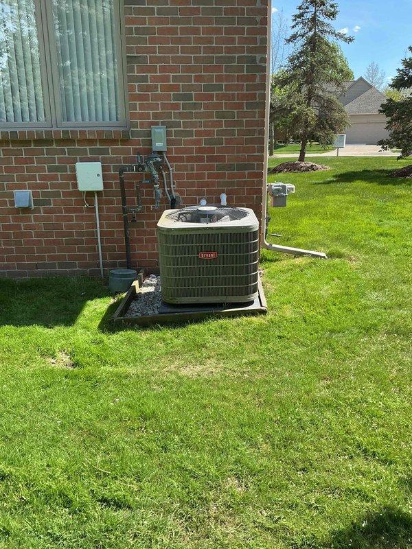 Completed comprehensive Gold AC inspection on 9-year-old Bryant air conditioning system with air handler located in basement. Performed full system evaluation including visual inspection of outdoor condenser unit, verified proper placement on pad with adequate clearance, inspected electrical disconnect and gas line connections mounted on exterior wall, and assessed refrigerant line routing. Checked condenser coil condition, fan operation, and overall unit integrity. Verified system operating under favorable weather conditions with ambient temperature above 65 degrees as required for accurate performance testing. Removed and disposed of filter packaging per protocol. Advised homeowner to maintain clear area around condenser unit, keeping it free from debris and animal waste to ensure optimal airflow and system efficiency. All system components found to be functioning properly with no immediate service needs identified. Unit exterior and surrounding installation area appear well-maintain