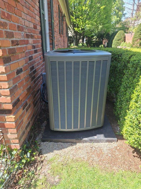 Completed installation of a 4-ton Lennox air conditioning system with matching evaporator coil at rear of residence. Unit was positioned on concrete pad against brick exterior wall with proper clearances maintained for service access and airflow. All mechanical and electrical connections were completed per manufacturer specifications and local code requirements, with permits requested for mechanical and electrical work. System was tested, charged, and verified operational upon completion.