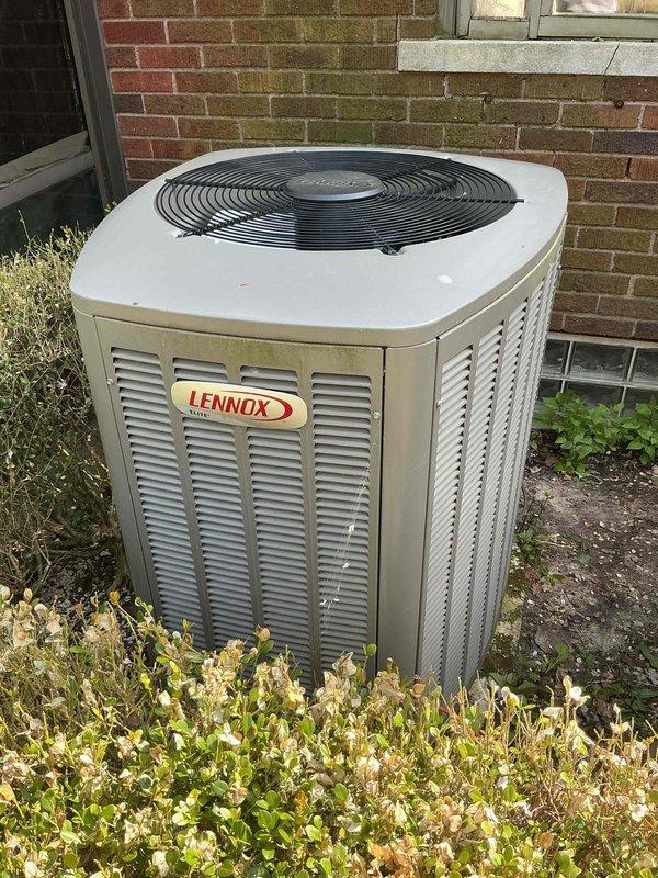 Responded to service call for 4-year-old Lennox AC unit not working properly due to wiring issue. Diagnosed faulty electrical connections at the control box located in attic space near basement coil. Identified compromised wire connections with improper terminations at the electrical control unit. Repaired and secured all wiring connections, including red and black conductors with proper wire nuts, ensuring secure terminations and code-compliant installation. Verified system operation and confirmed proper electrical flow to condenser unit positioned at exterior brick wall. Unit restored to full operational status.