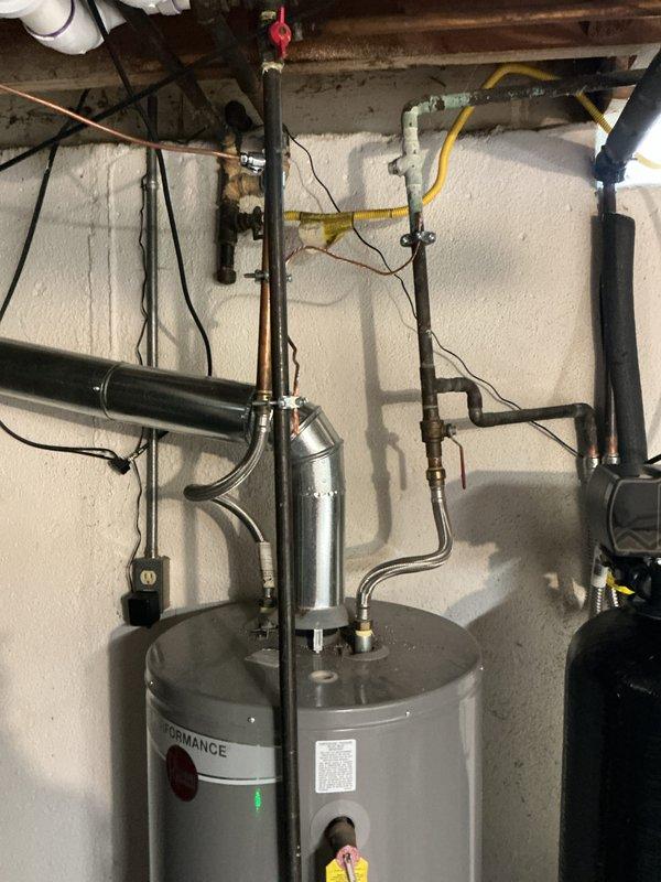 Provided estimate for tankless water heater installation as an alternative to the existing standard atmospheric gas water heater currently in service. Evaluated existing utility room configuration, gas line capacity with measuring equipment, venting requirements, and plumbing connections to determine feasibility and scope for tankless conversion versus traditional tank replacement.