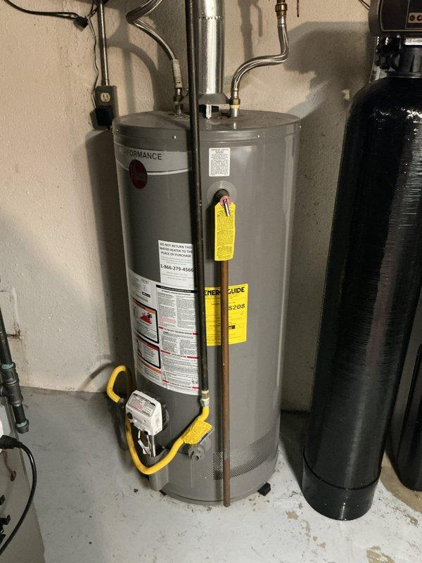 Provided estimate for tankless water heater installation as an alternative to the existing standard atmospheric gas water heater currently in service. Evaluated existing utility room configuration, gas line capacity with measuring equipment, venting requirements, and plumbing connections to determine feasibility and scope for tankless conversion versus traditional tank replacement.