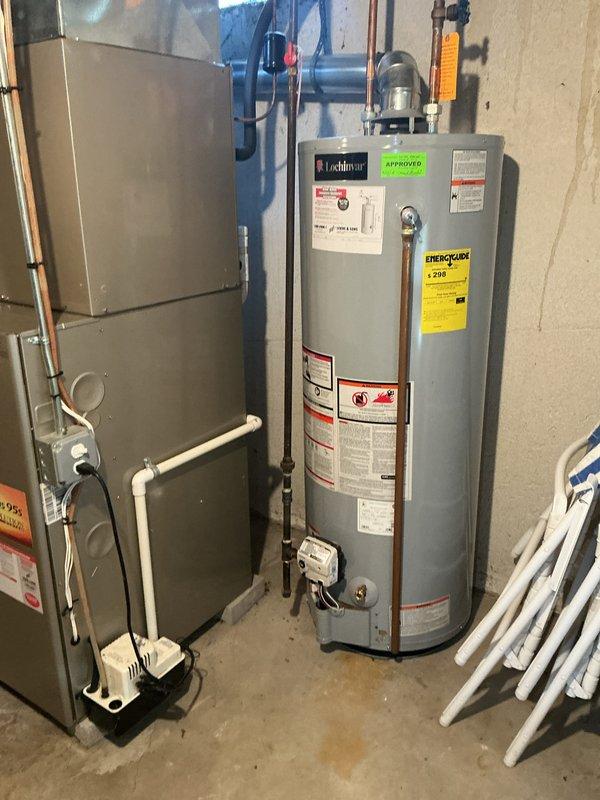 Completed comprehensive Gold AC Inspection on 10+ year old single-unit HVAC system with basement-located air handler. Performed full system evaluation including thermostat functionality check of Bryant Evolution System digital control, verified equipment operational status, and documented existing conditions through photographic records. Inspected furnace unit, associated ductwork, and mechanical components in basement utility area. System confirmed operational at time of inspection with all equipment functioning as designed.
