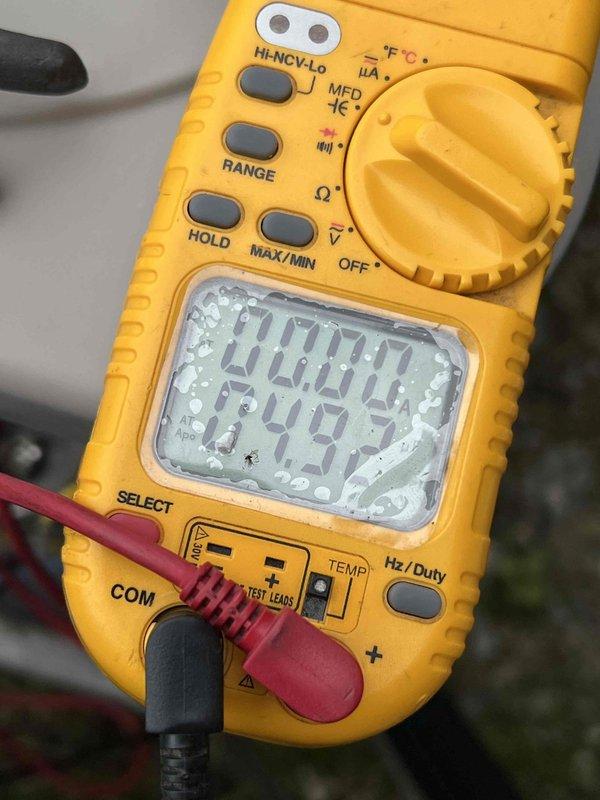 Completed Gold AC Inspection on 13-year-old air conditioning system with basement-located air handler. Performed comprehensive electrical diagnostics using digital multimeter, measuring voltage and capacitance readings to verify proper system operation. All electrical components tested within normal operating parameters, with voltage reading of 379.9V and secondary measurement of 1007, confirming system is functioning correctly and ready for cooling season.
