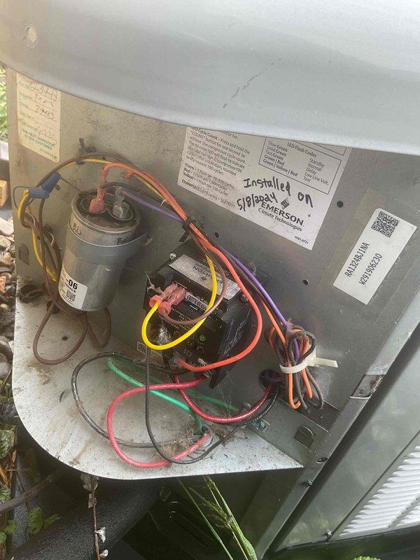 Completed comprehensive Gold AC inspection on 7-year-old residential air conditioning system with air handler located in basement. Performed full system evaluation of outdoor condenser unit and inspected interior electrical components, motor assembly, capacitor, and wiring connections. All electrical connections found secure with proper wire terminations. Verified condenser unit operational status, examined fan assembly and louvered intake panels for proper airflow. Documented system installation date and component condition through photographic records. Unit operating as designed with no immediate service needs identified. Customer renewed Gold Plan membership onsite during appointment.