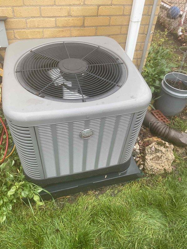 Completed comprehensive Gold AC inspection on 7-year-old residential air conditioning system with air handler located in basement. Performed full system evaluation of outdoor condenser unit and inspected interior electrical components, motor assembly, capacitor, and wiring connections. All electrical connections found secure with proper wire terminations. Verified condenser unit operational status, examined fan assembly and louvered intake panels for proper airflow. Documented system installation date and component condition through photographic records. Unit operating as designed with no immediate service needs identified. Customer renewed Gold Plan membership onsite during appointment.
